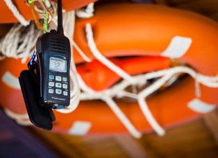 Mobile phone tied with rope to life preserver